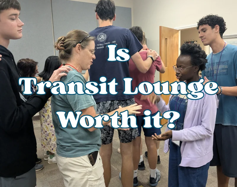 Title: Is Transit Lounge Worth It? in white letters outlined in blue over a picture of students playing Rock, Paper, Scissors